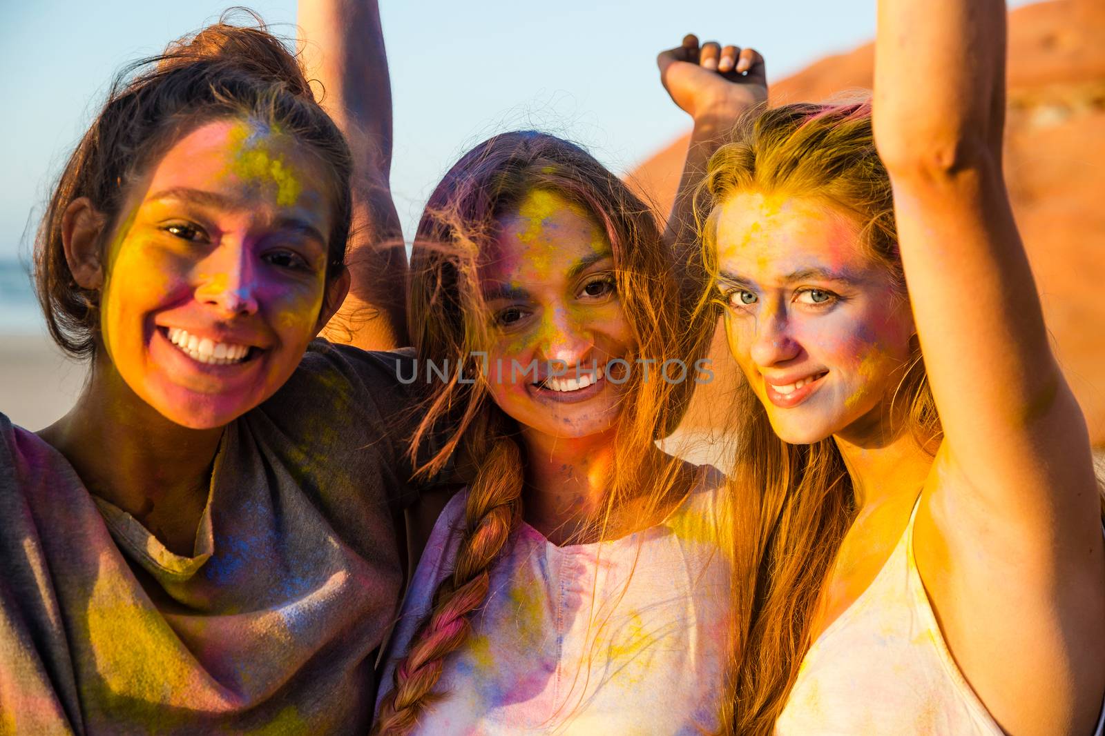 Best friends full of colored powder all over the body