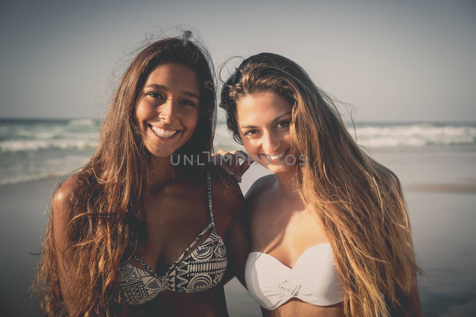 Best friends having fun on the beach 