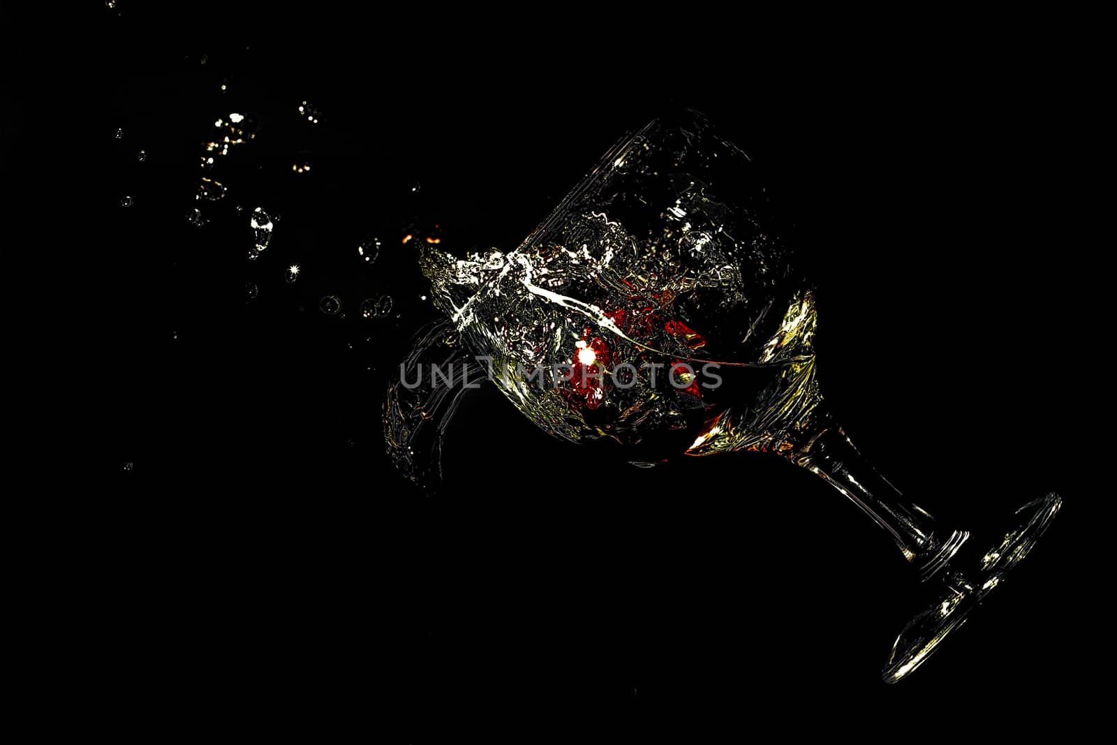 glass dropping with strawberry inside
