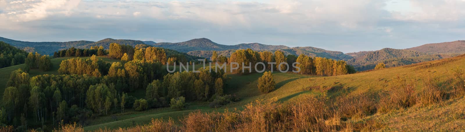 Beauty dawn in the mountains in Altay, panoramic picture