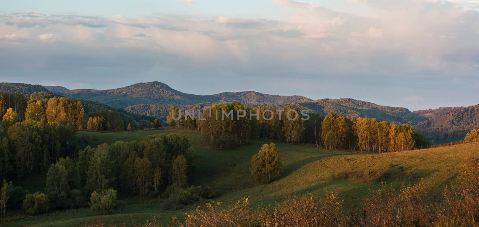 Beauty dawn in the mountains in Altay, panoramic picture