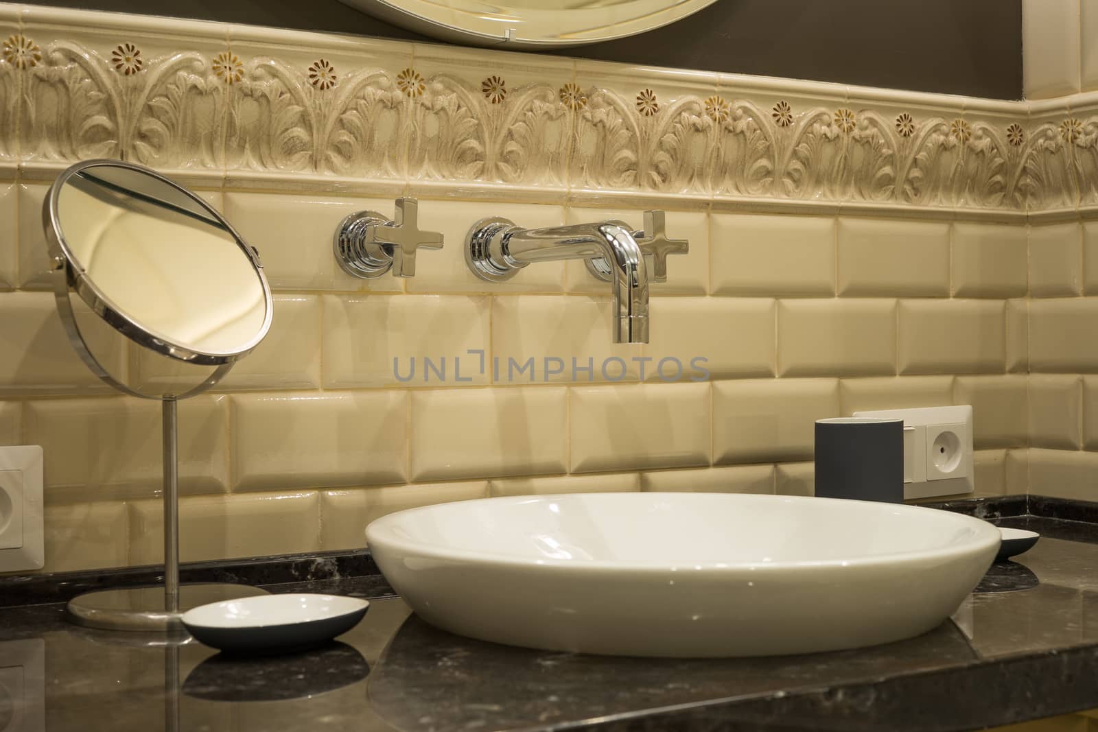 Washbasin faucet mirror in a luxurious bathroom by mrivserg