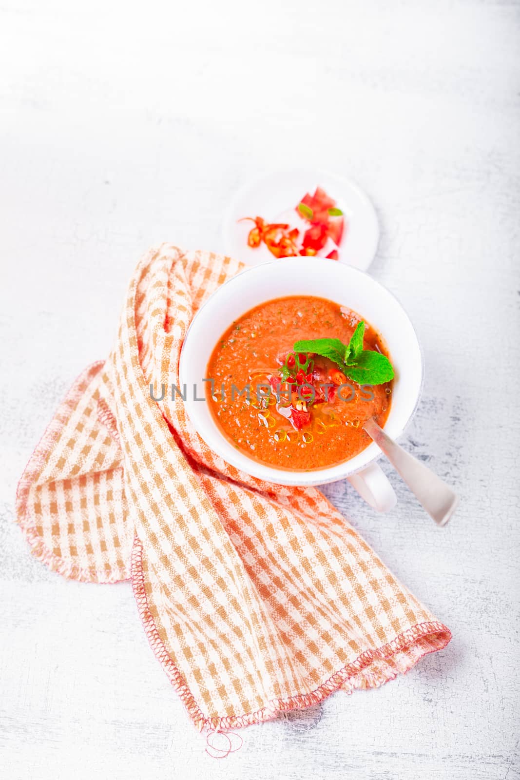 Bowl of Fresh tomato soup Gazpacho on a white background. by supercat67