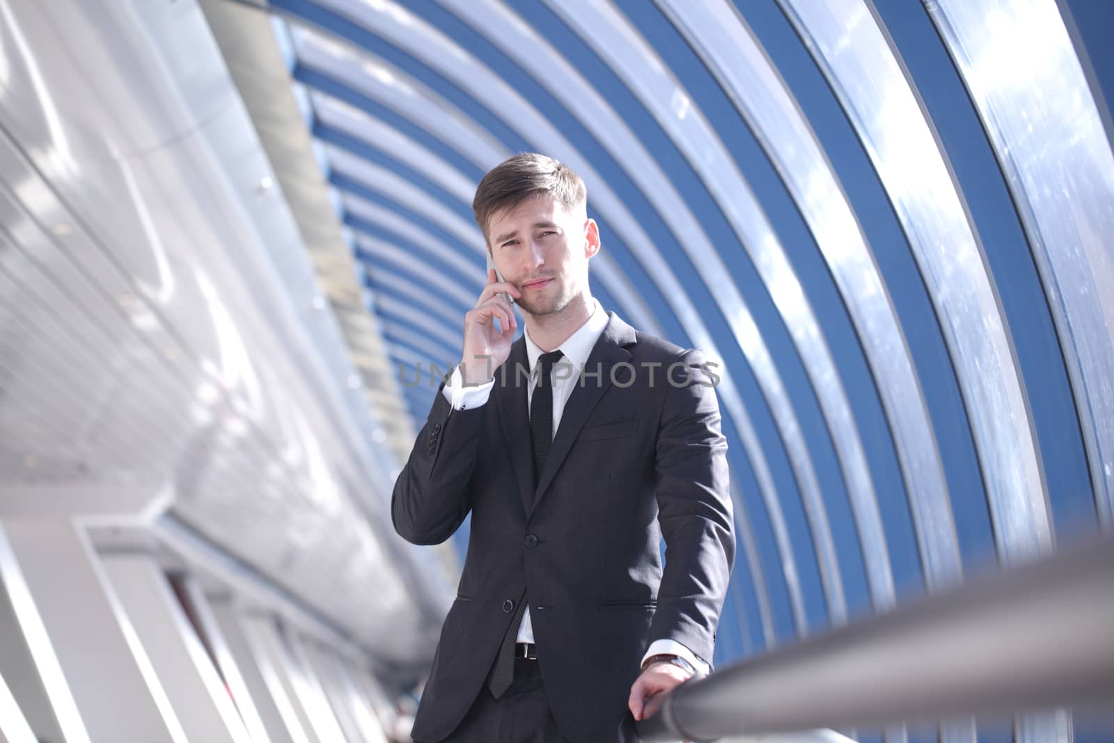 Businessman talking on the phone in modern building