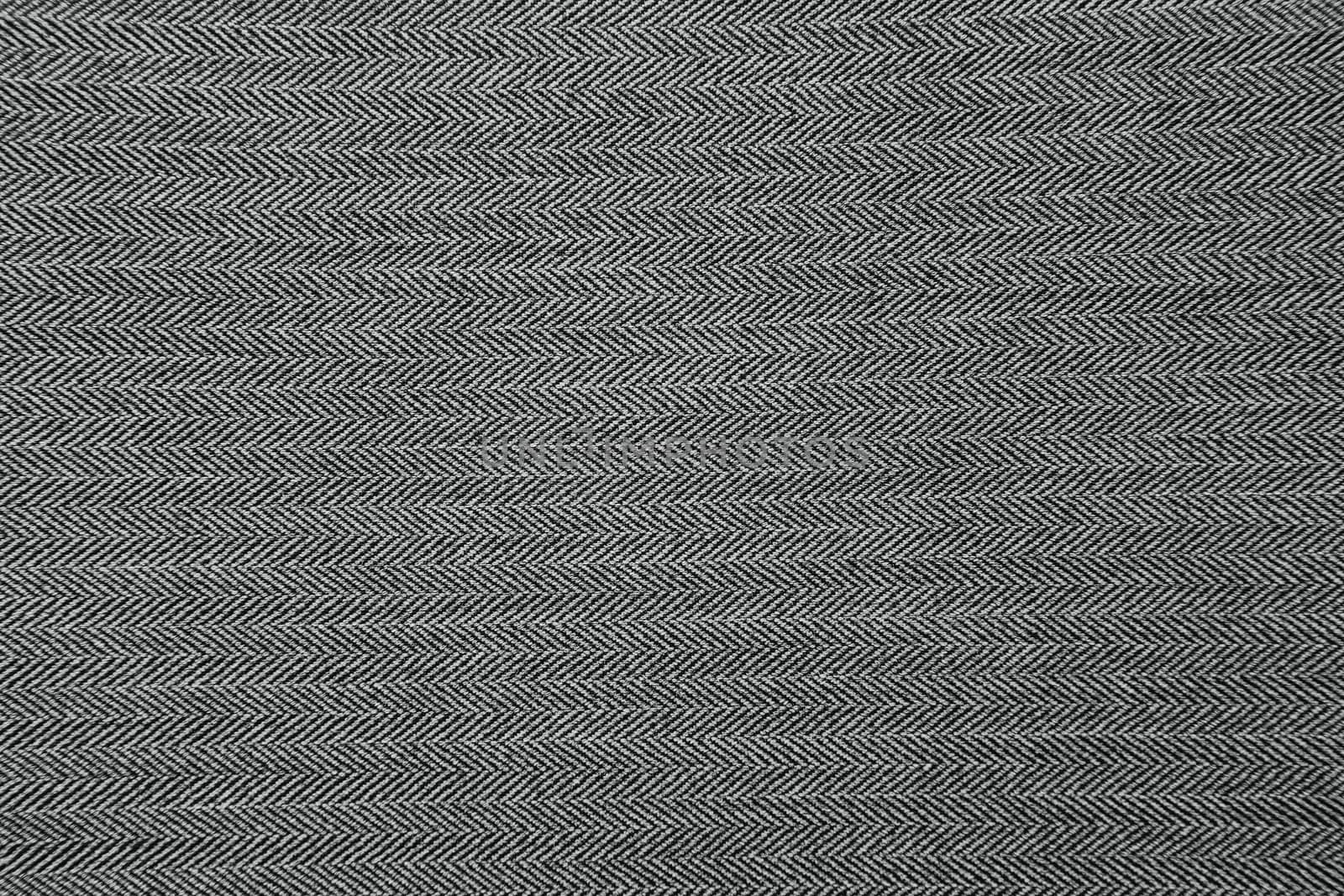 Grey herringbone fabric pattern texture background closeup