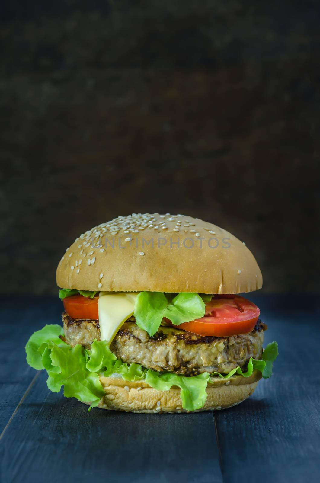 Closeup of home made burgers on wooden background