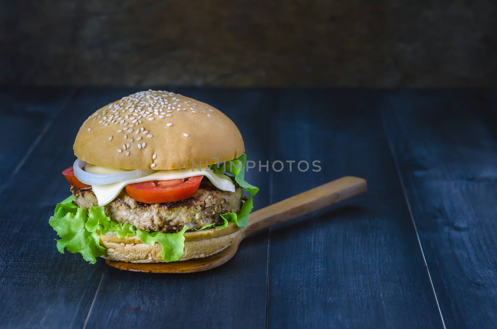 Closeup of home made burgers on wooden background