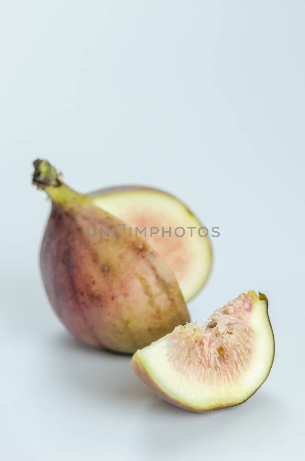 sliced fresh figs fruit on white background