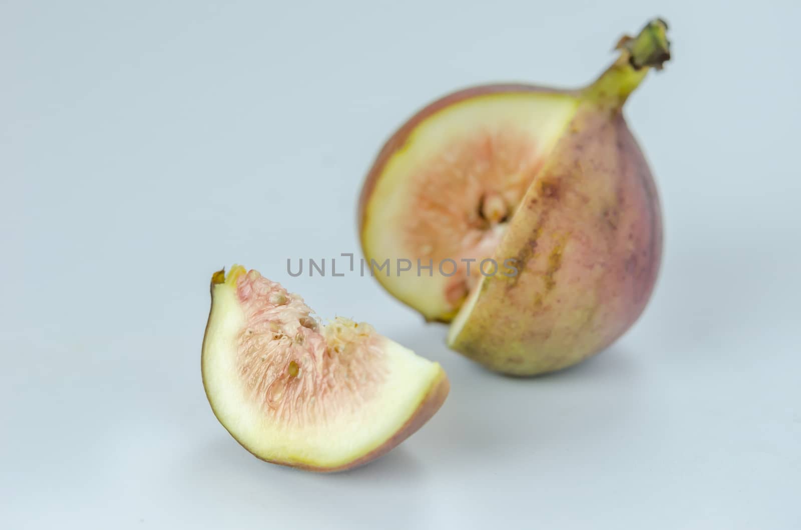 sliced fresh figs fruit on white background
