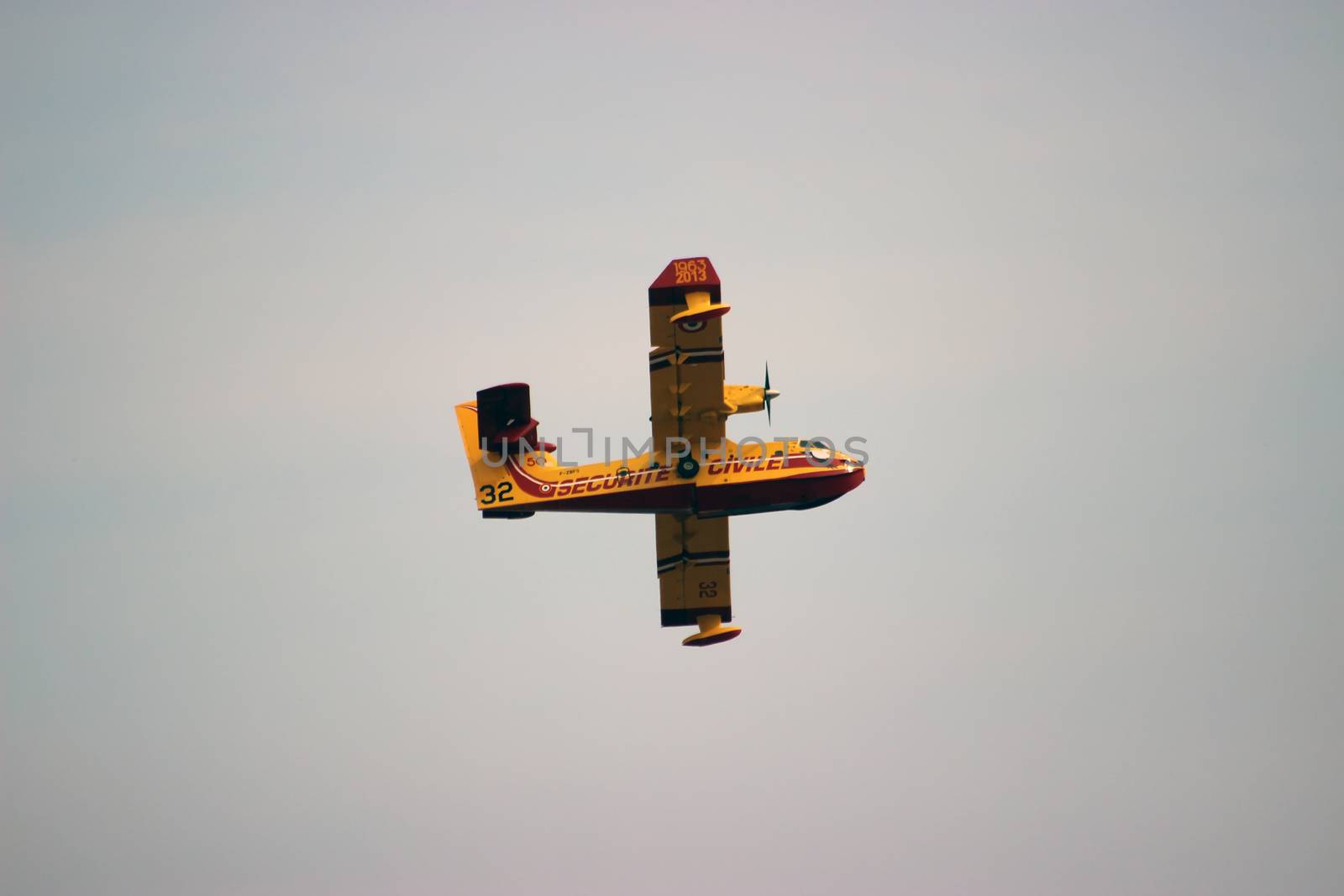 Menton, France - September 9, 2015: Canadair CL-415 (Bombardier 415 Superscooper) Airplane Extinguish Forest in Flame in Menton, French Riviera