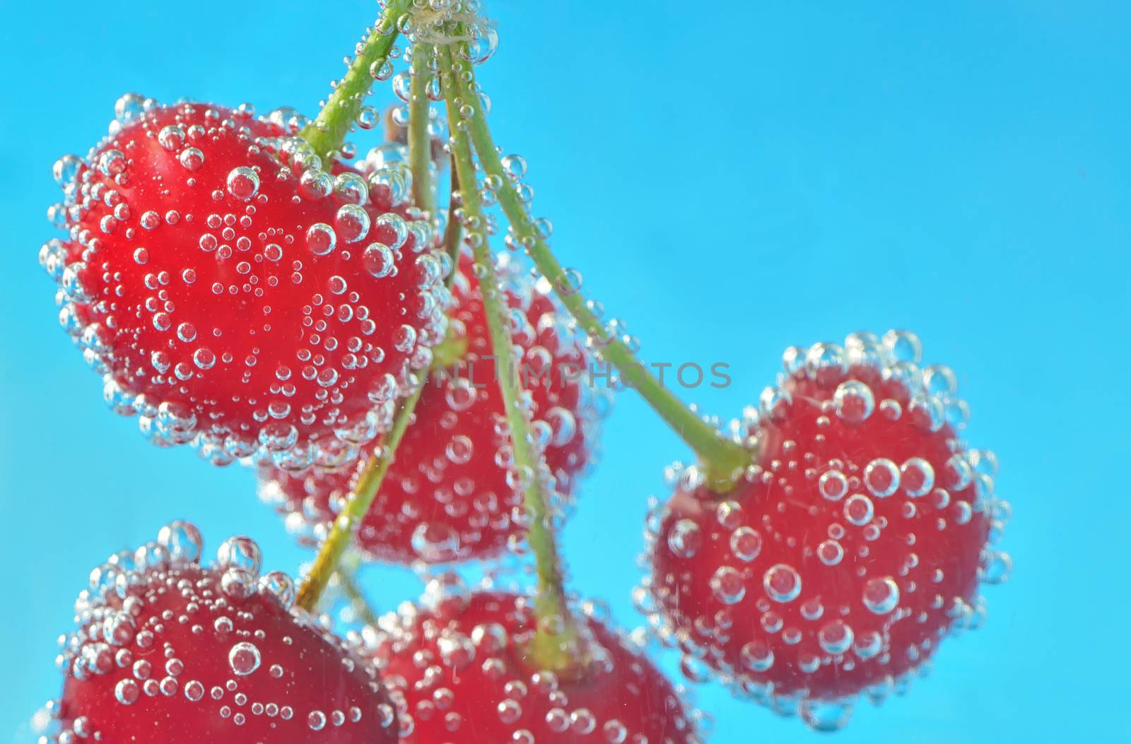 Cherry and bubbles in water
