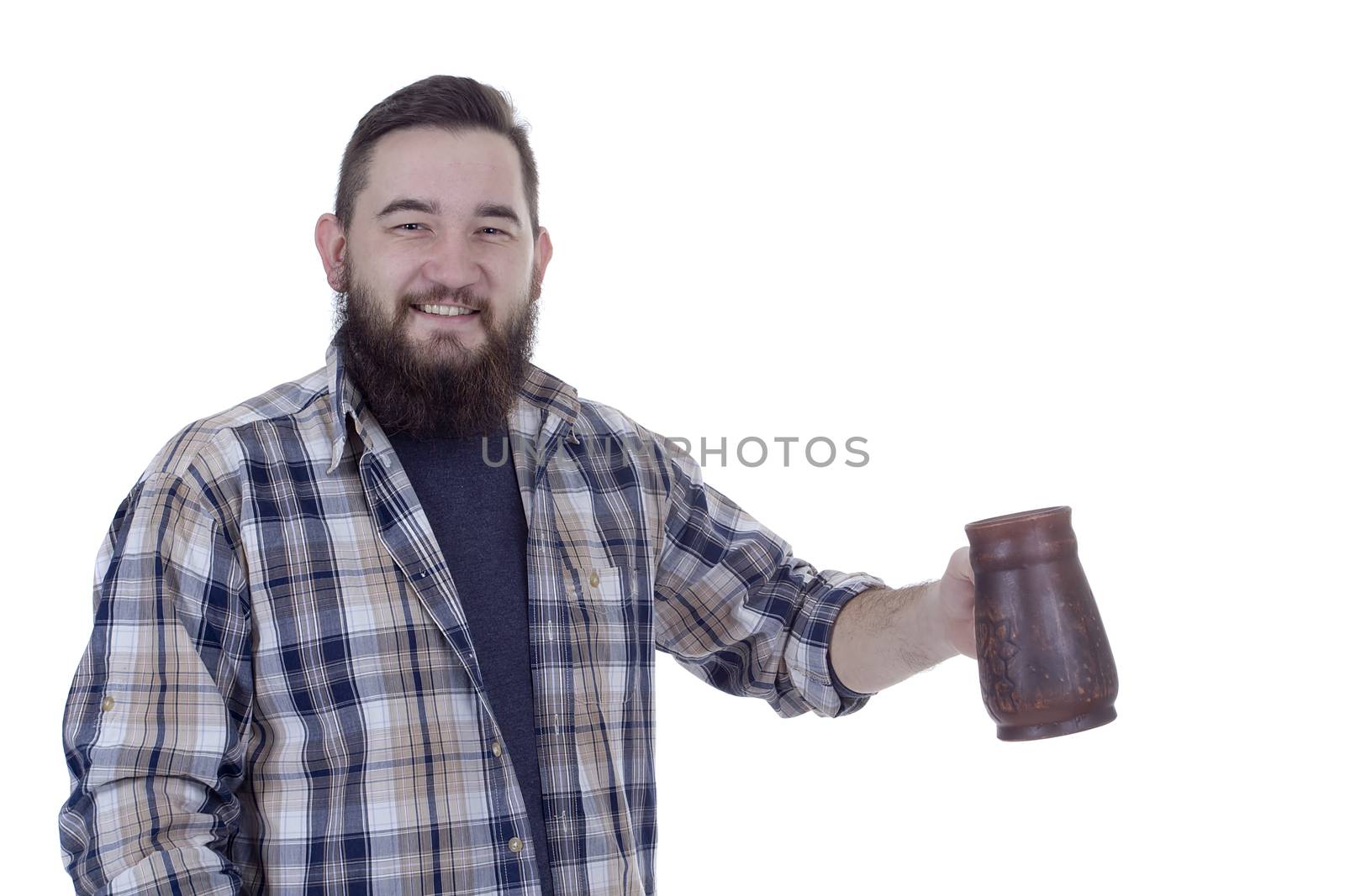 Happy bearded man with a clay beer mug