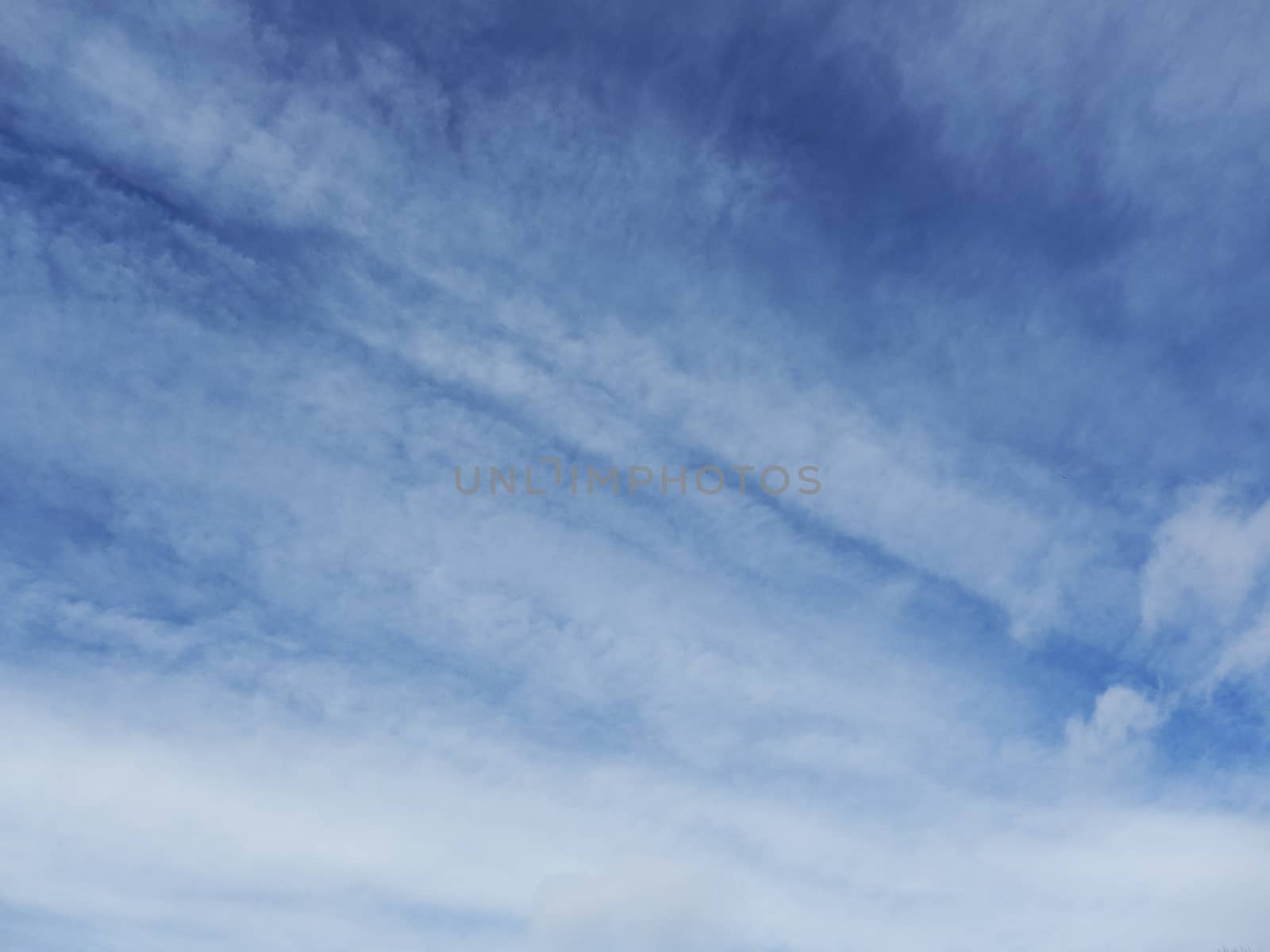 sky replacement, blue sky with diagonal clouds