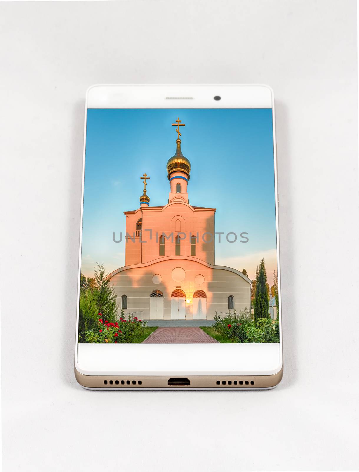 Modern smartphone displaying full screen picture of orthodox church, Russia. Concept for travel smartphone photography. All images in this composition are made by me and separately available on my portfolio