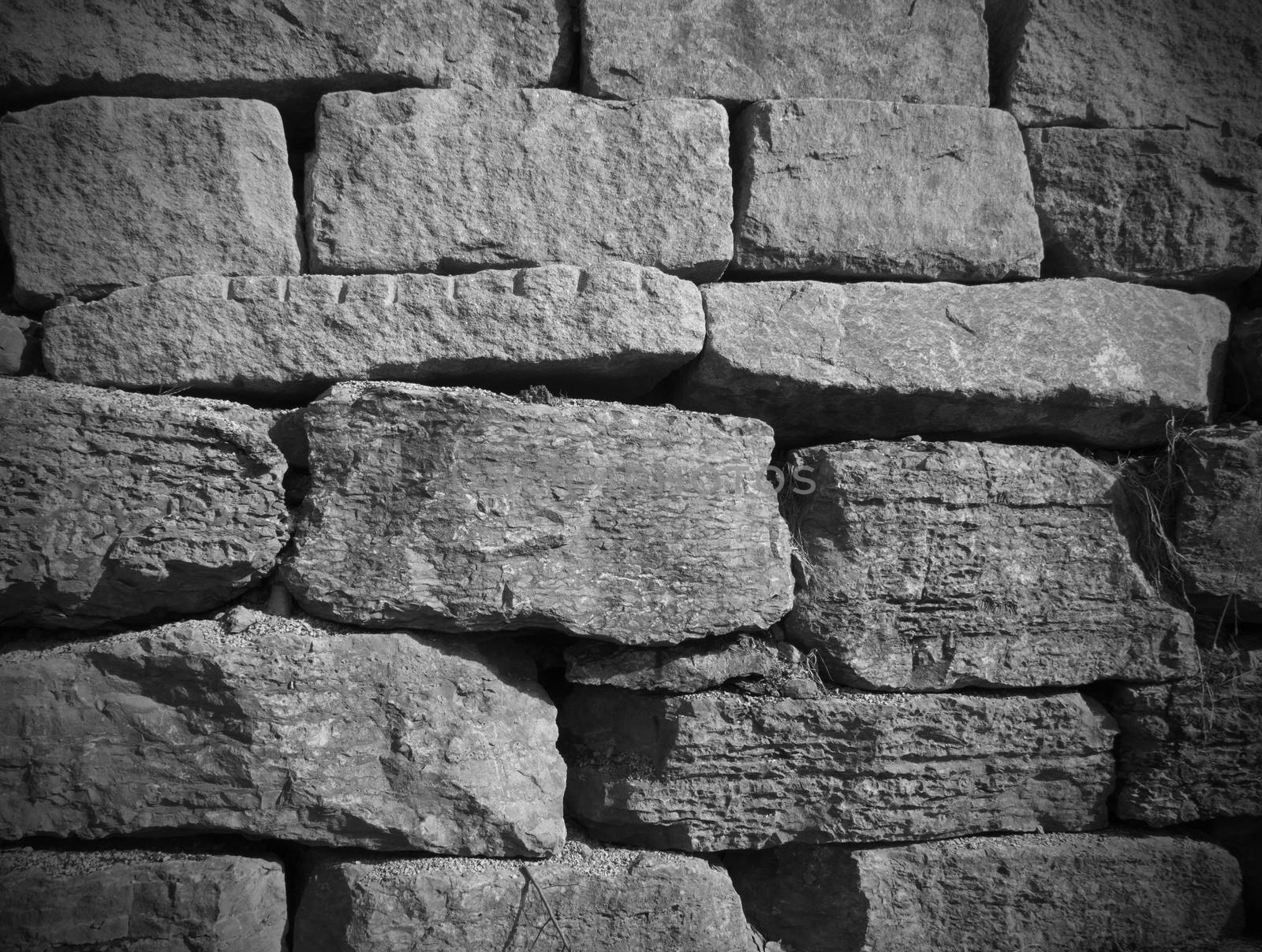 stone wall background with black and white  stones with dark edges