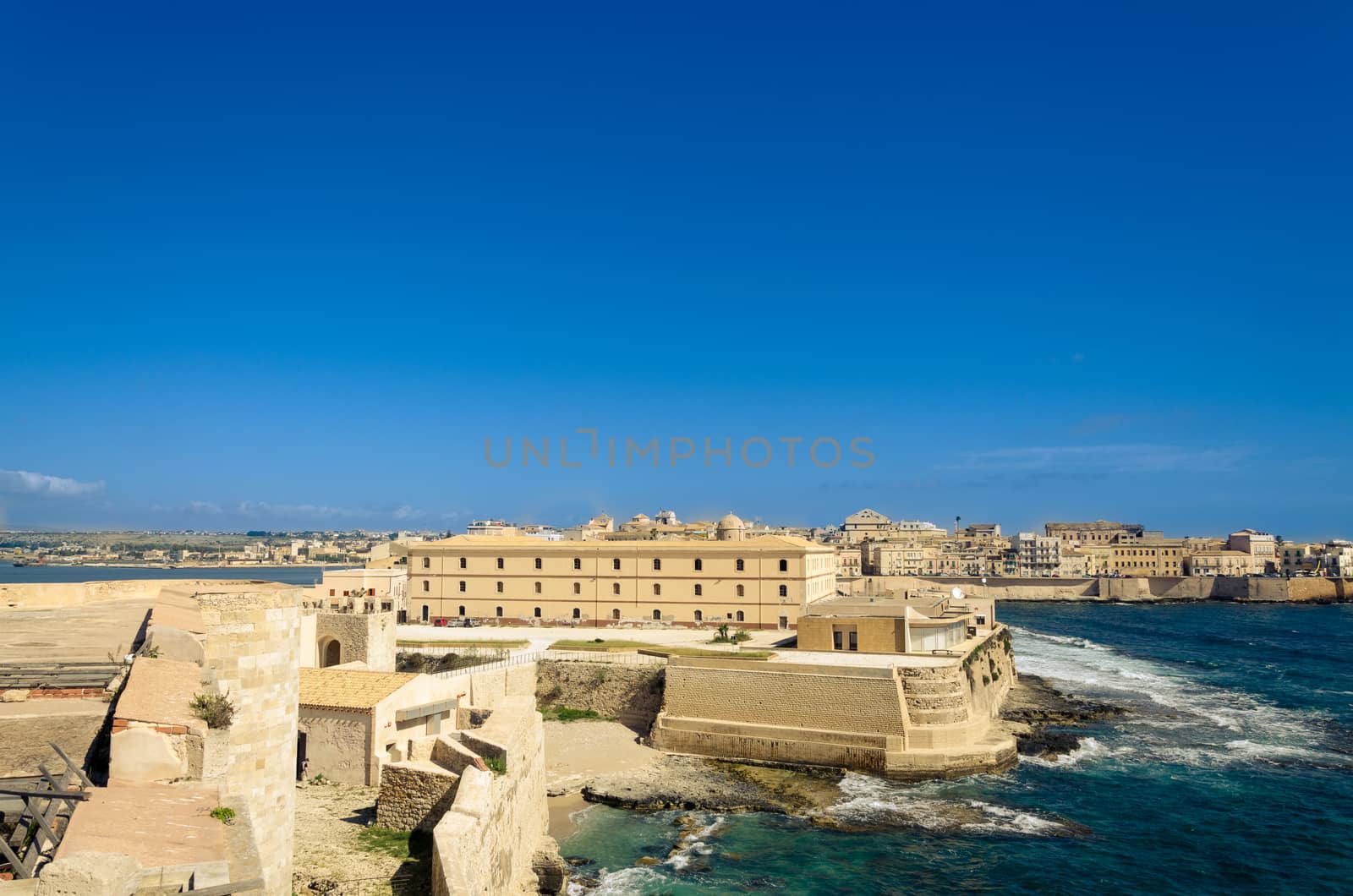 Scenic view of Maniace castle on sea, Syracuse, Sicily, Italy