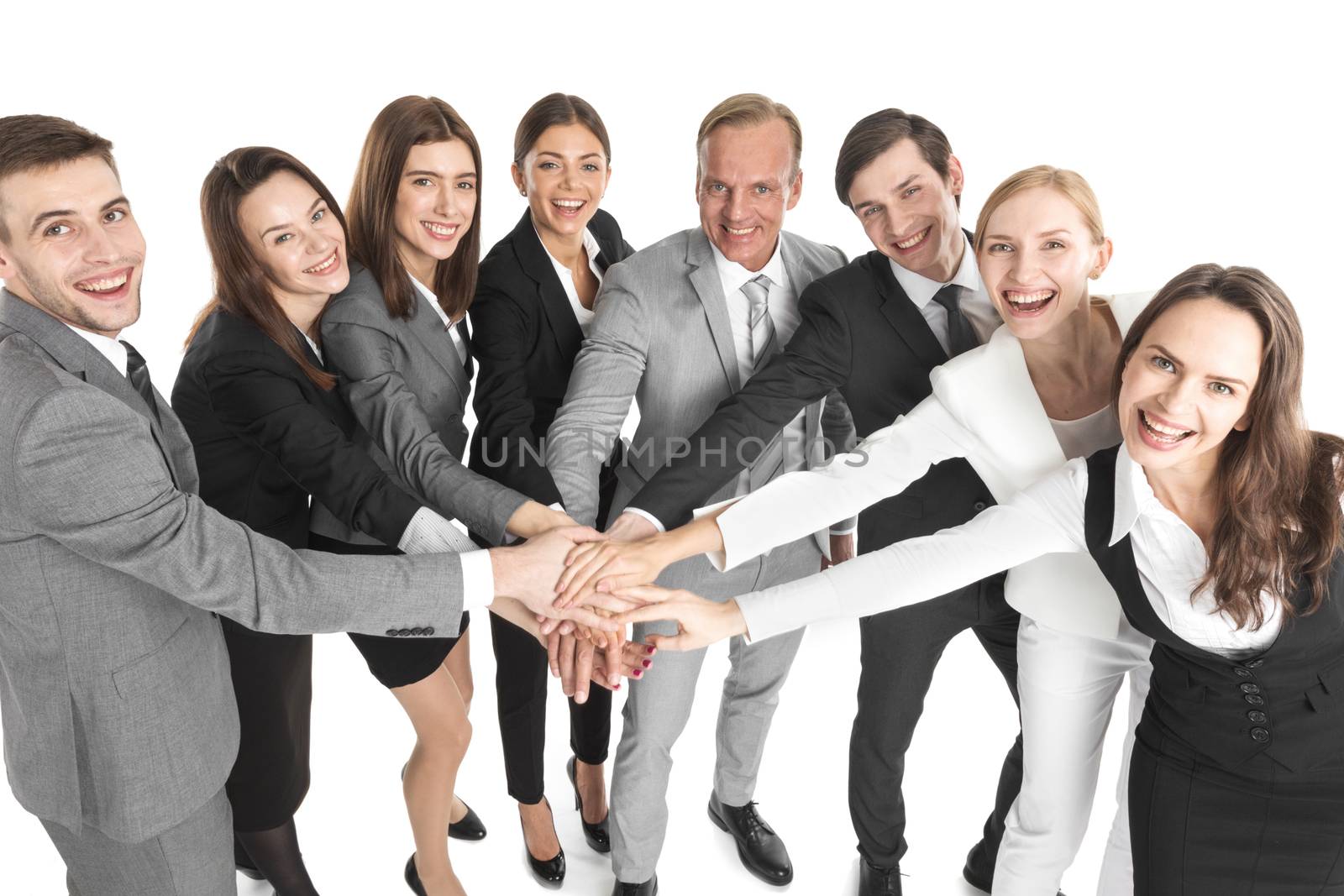 Concept of teamwork. Business people team joined hands, isolated on white background