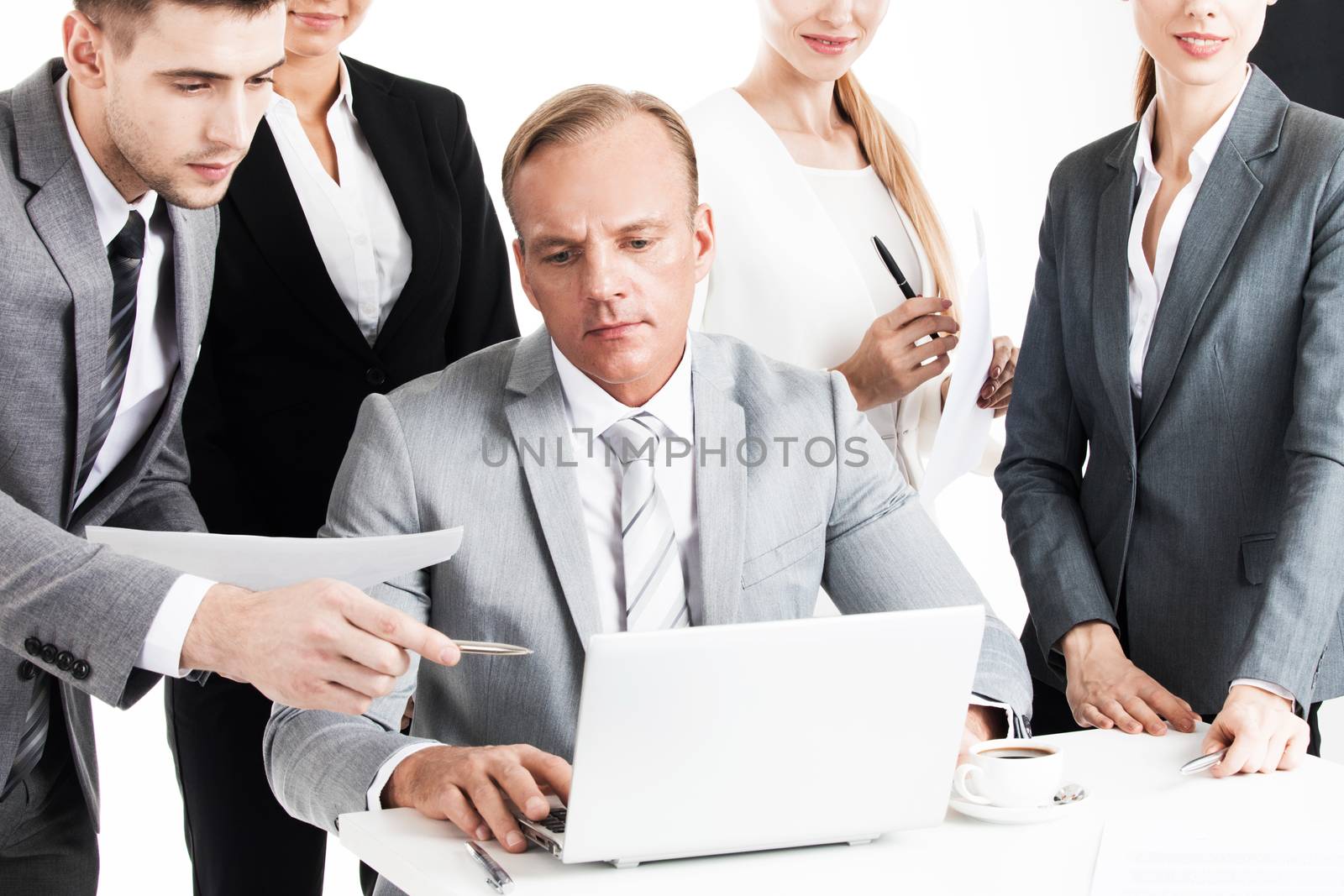 Business team working with laptop and documents together