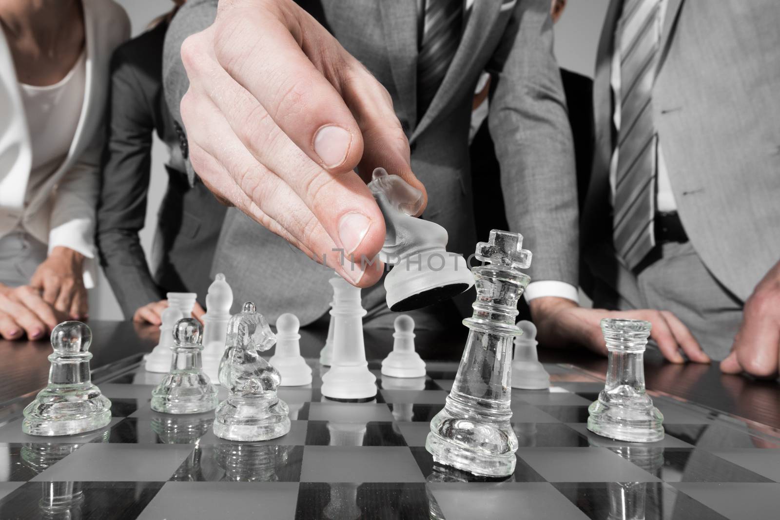 Business people team playing chess, business strategy concept