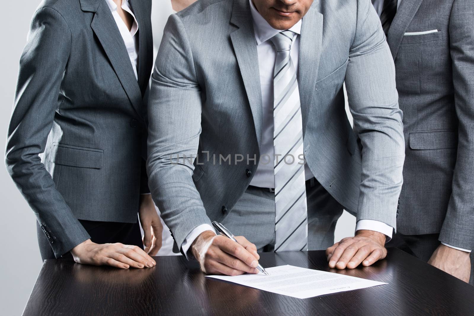 Businessman signing contract by Yellowj