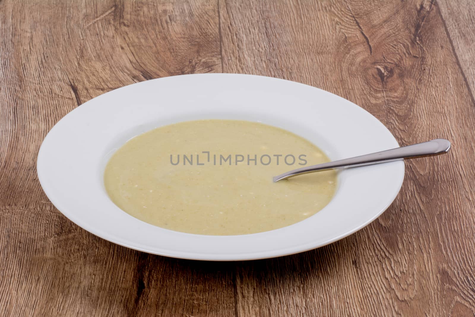 Vegetarian vegetable soup on a wooden table