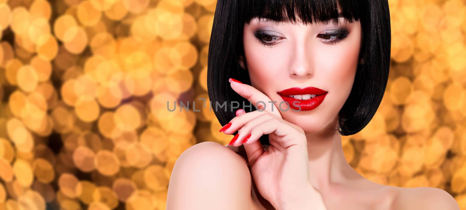 Pretty woman against an abstract background with blurred lights