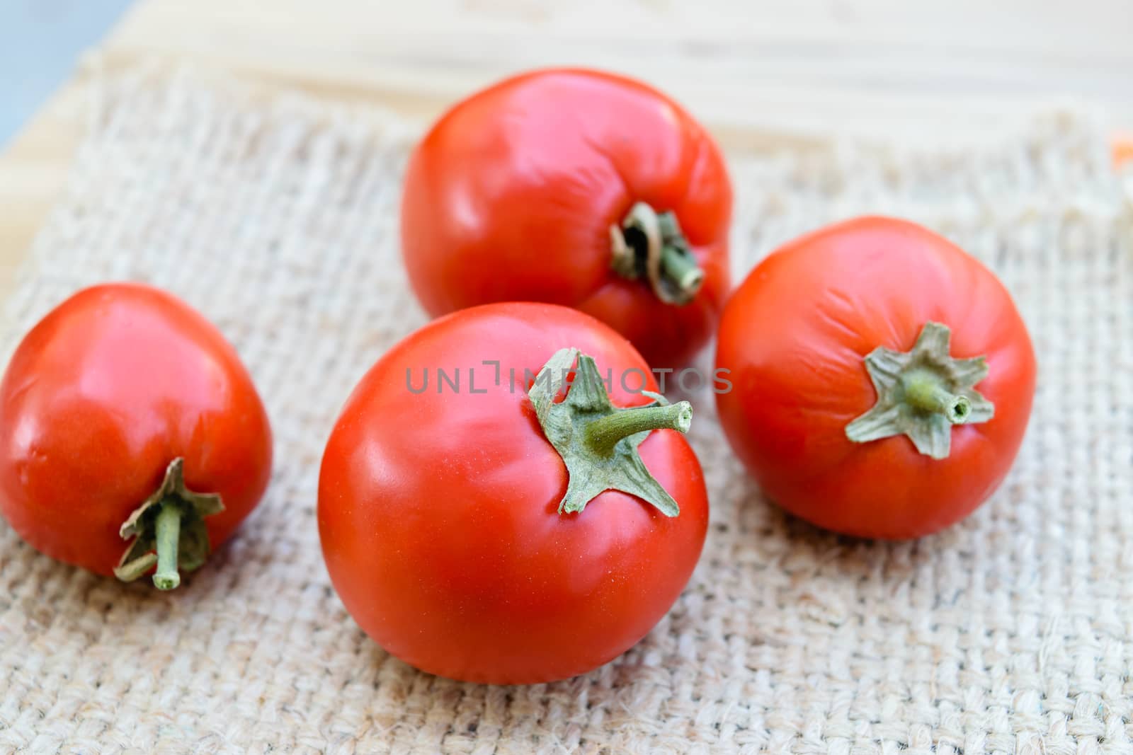 Ripe red tomatoes on sack
