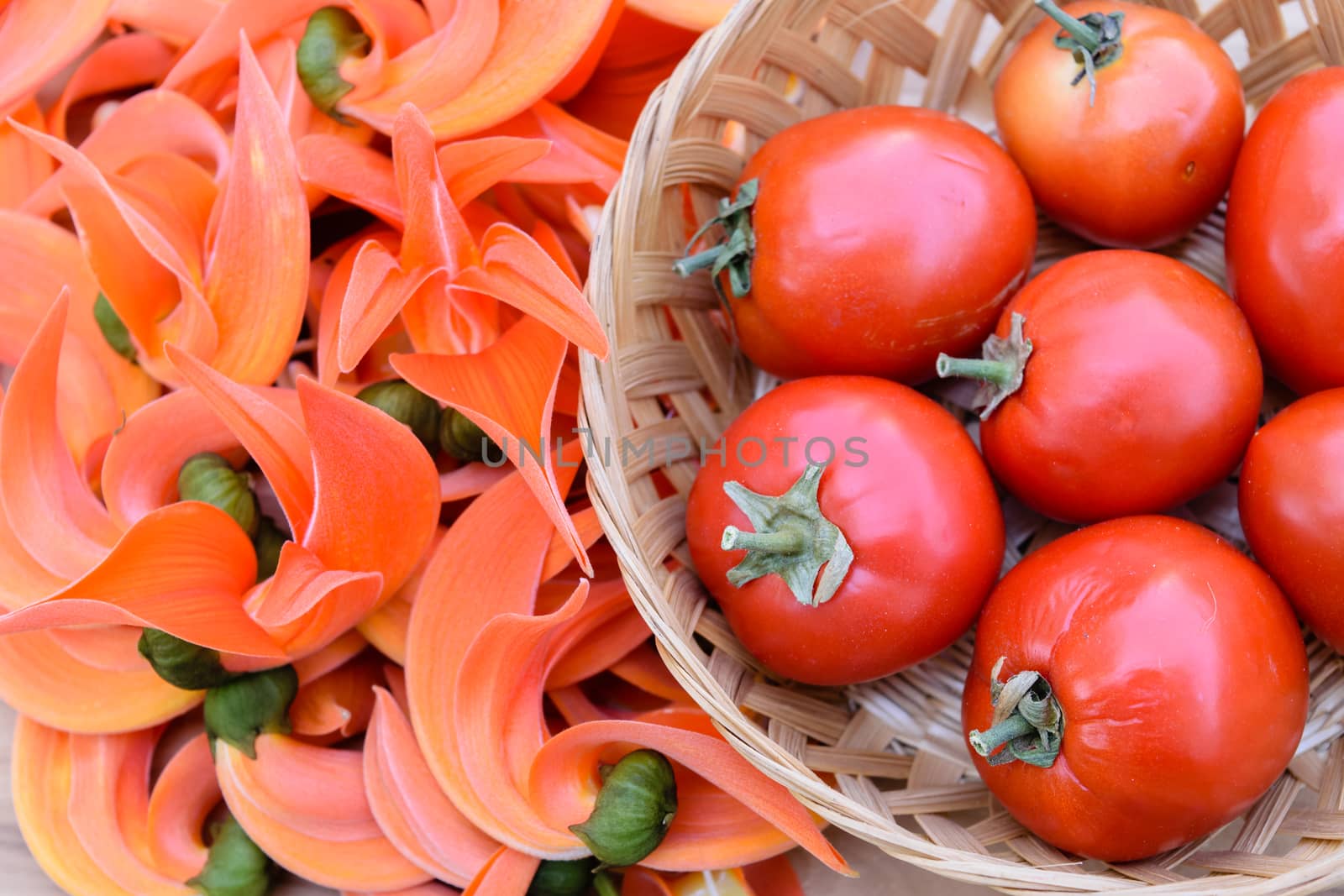 Ripe red tomatoes on bamboo basket