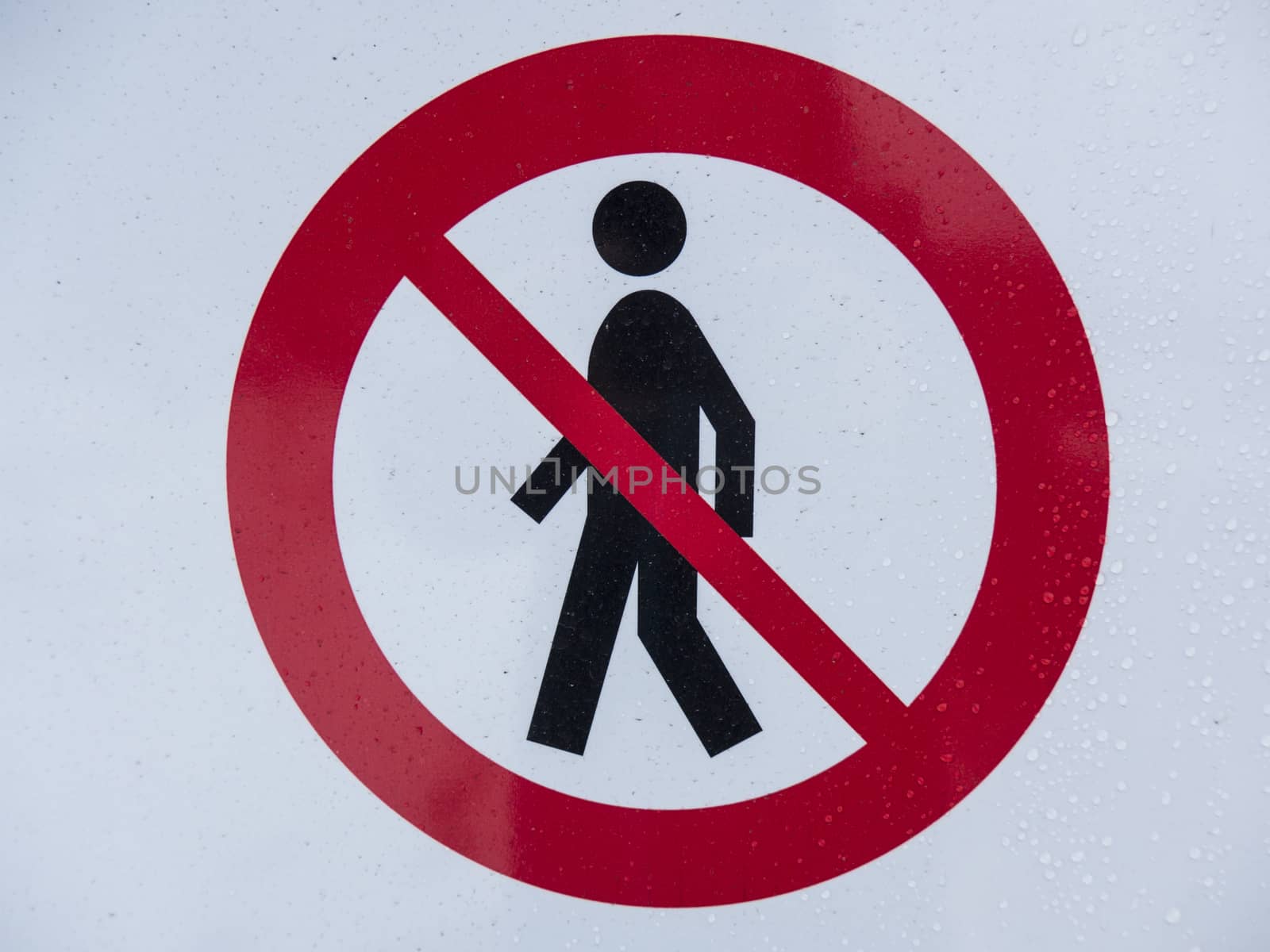 a red no walking sign