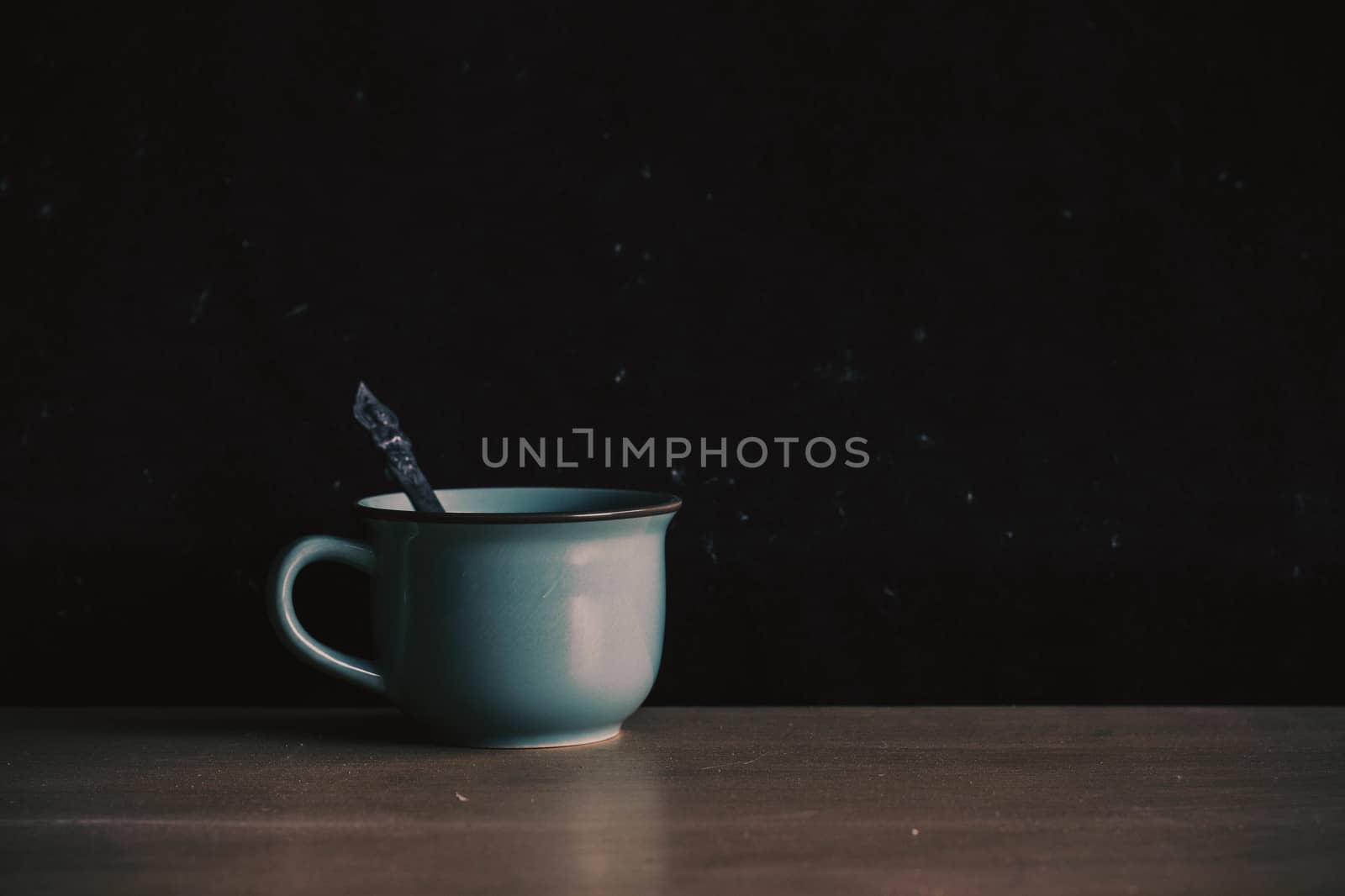 cup on the old wooden and dust. by start08