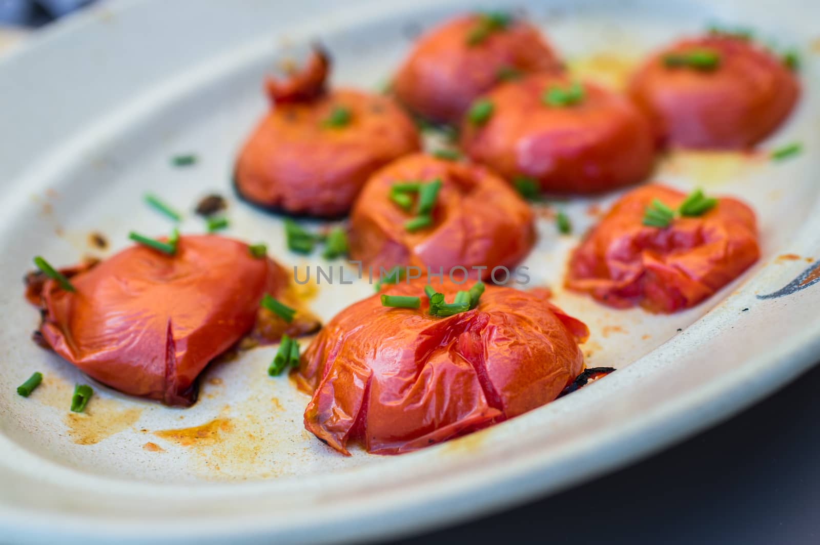 grilled tomato halves cut in the plate