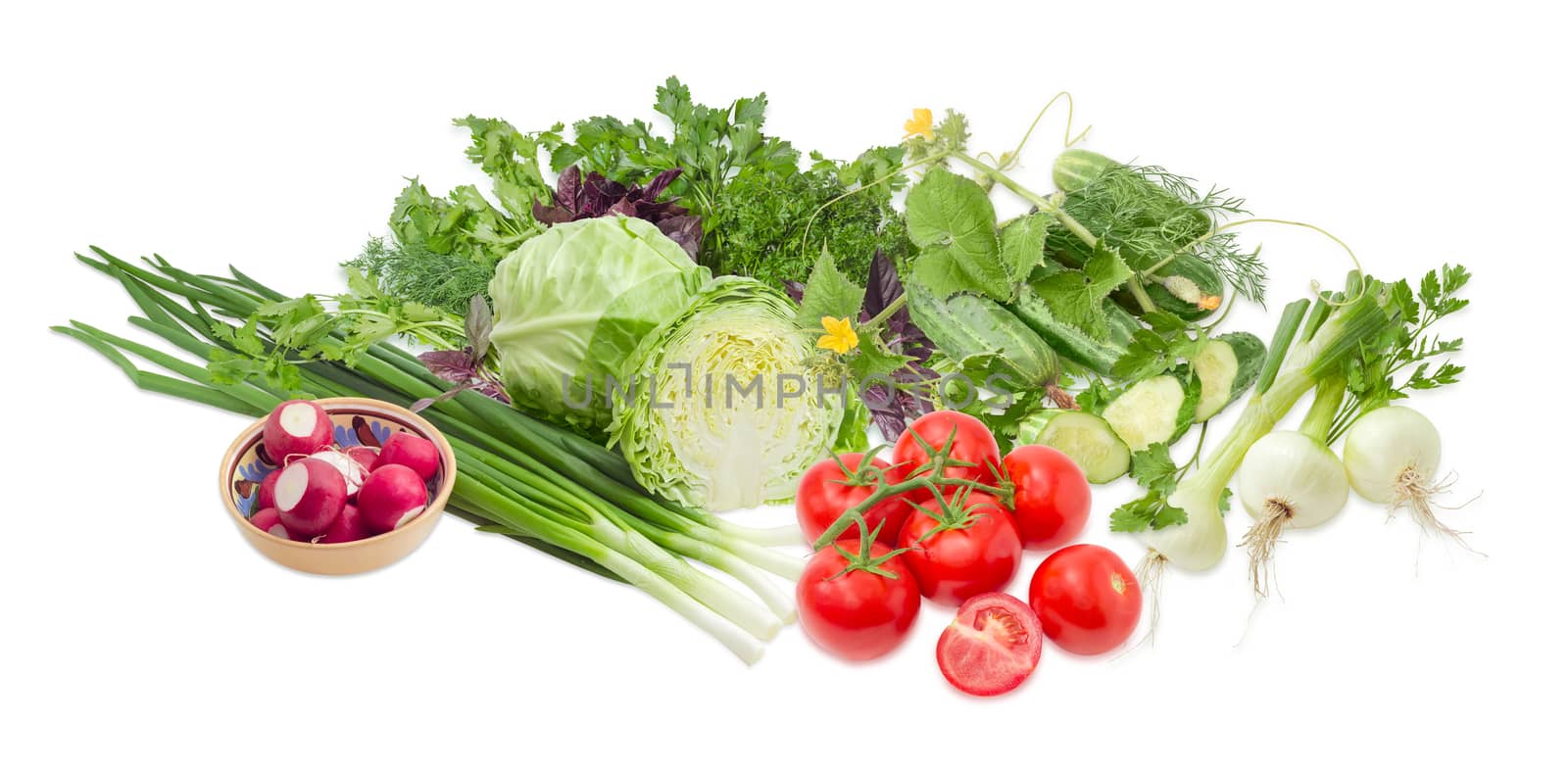 Pile of different early vegetables, like young white cabbage, tomatoes, onion bulbs, green onion, red radish, cucumbers and potherb, like parsley, dill, basil, cilantro on a light background
