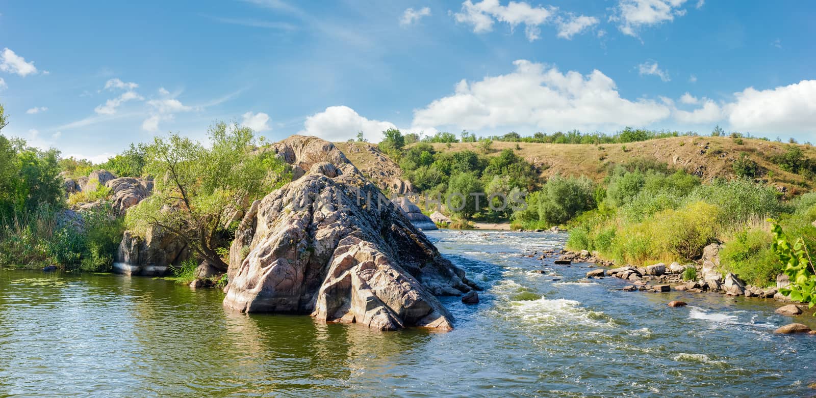 Panorama of the river section with rapids and rocky shore by anmbph