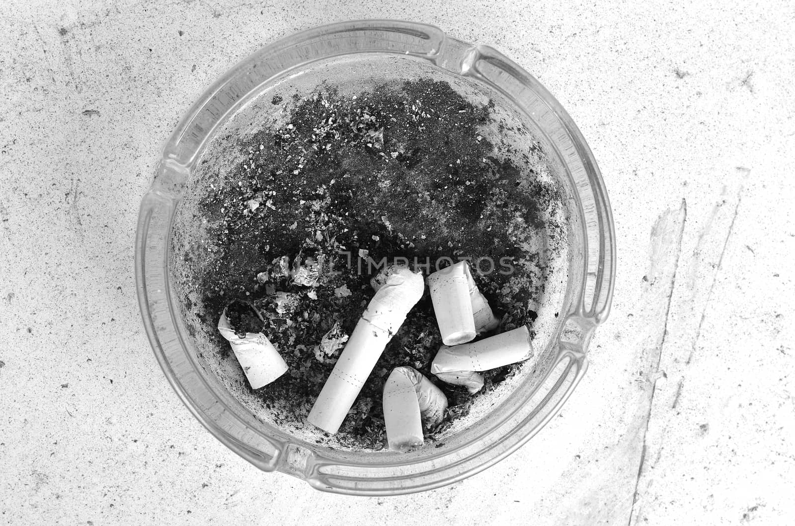 Ashtray full of cigarettes burn