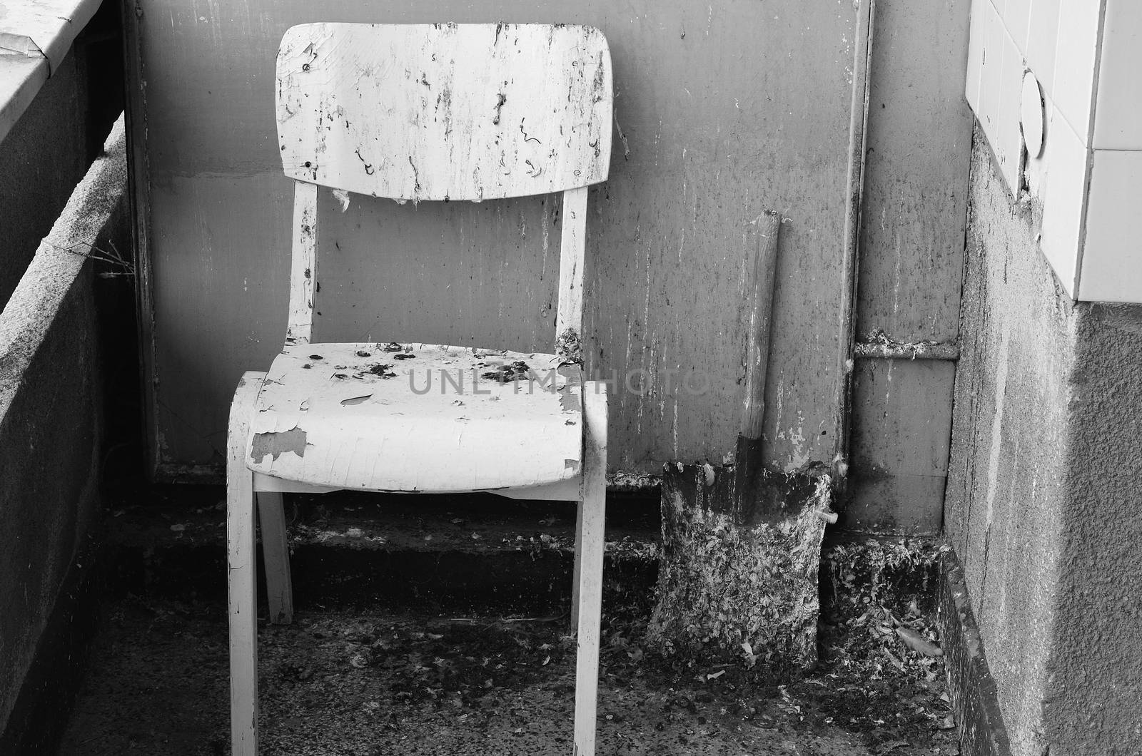 Dirty old chair on black and white theme