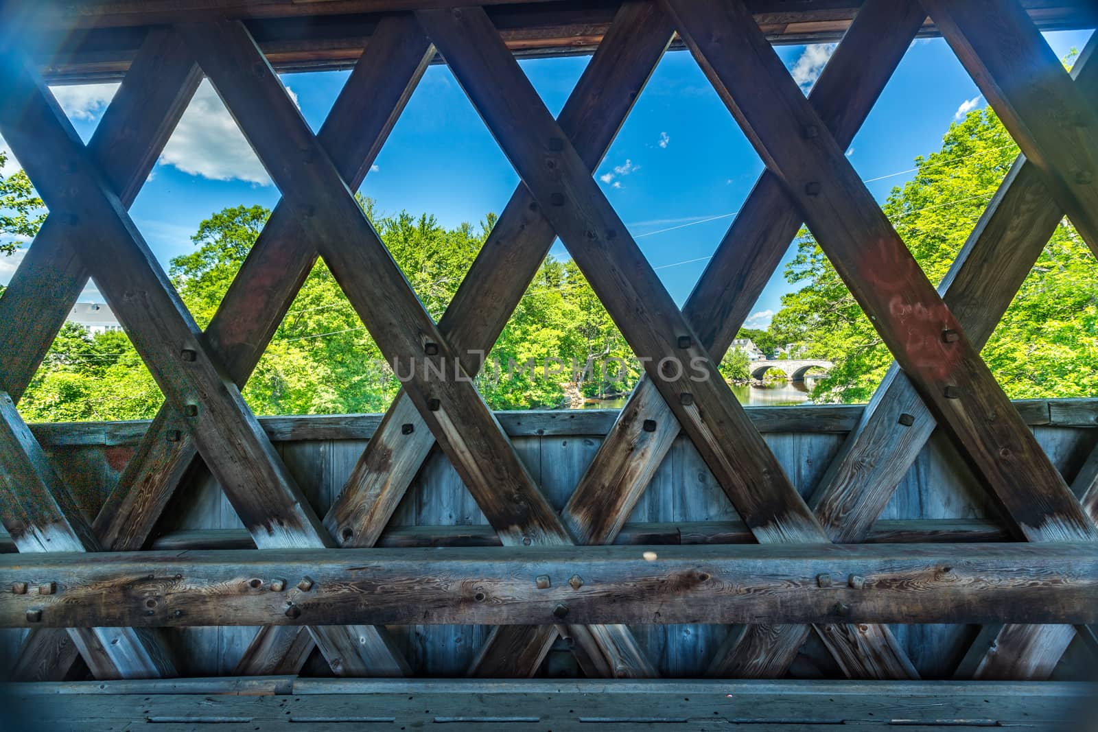 The Henniker Covered Bridge is a covered pedestrian footbridge serving New England College across the Contoocook River in Henniker, New Hampshire.