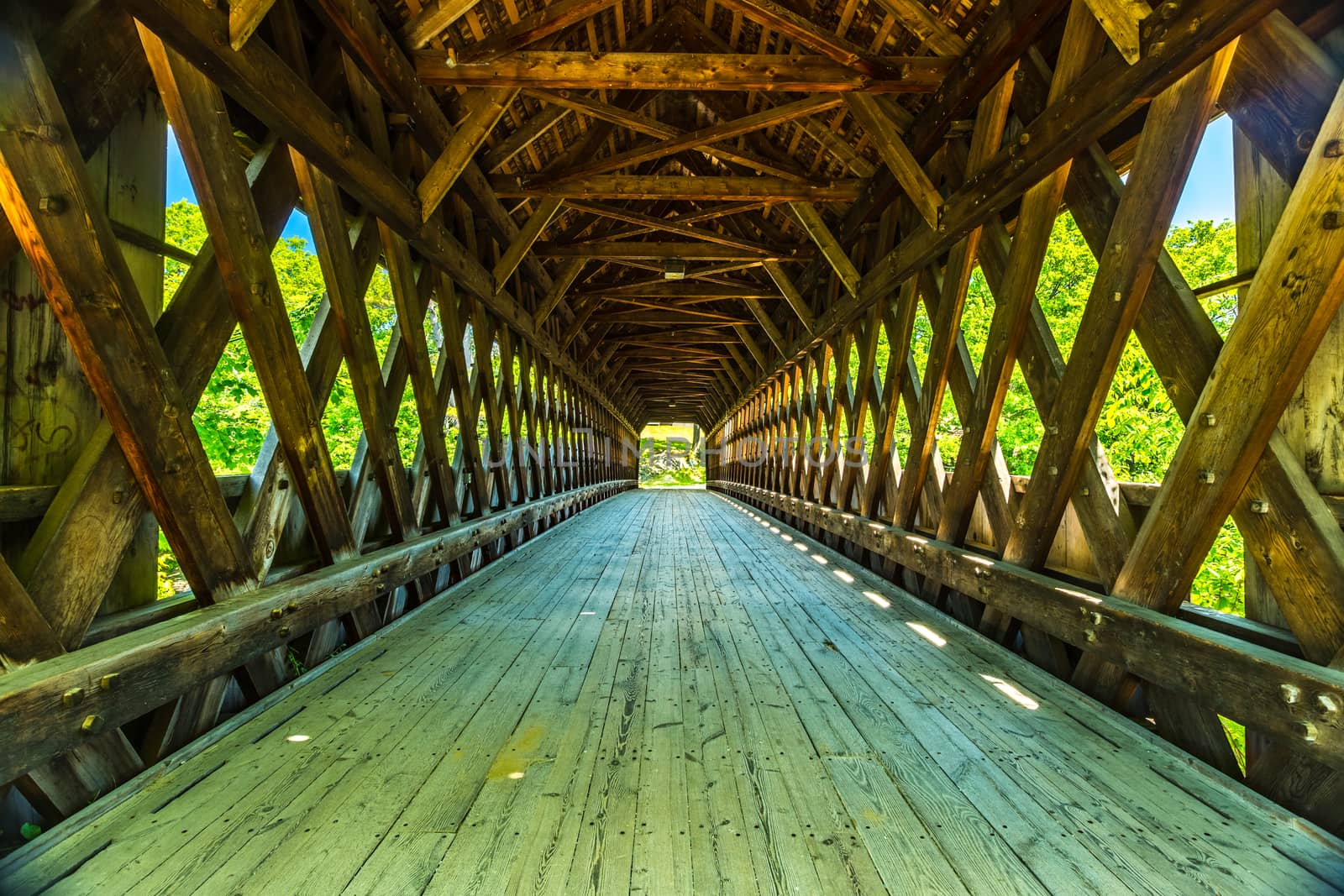 The Henniker Covered Bridge is a covered pedestrian footbridge serving New England College across the Contoocook River in Henniker, New Hampshire.