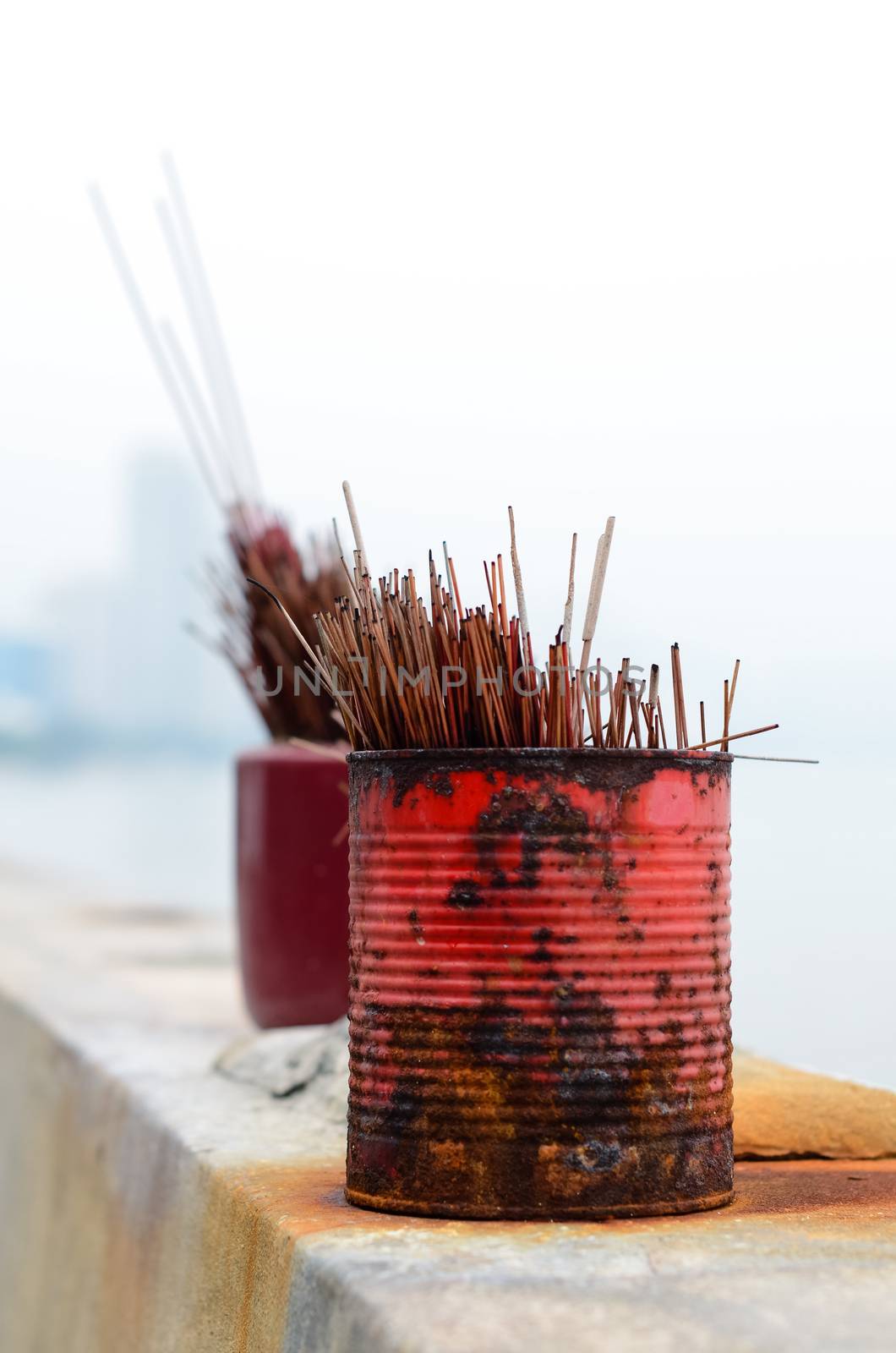 Banks of used red and magenta incense sticks in a temple Malaysia