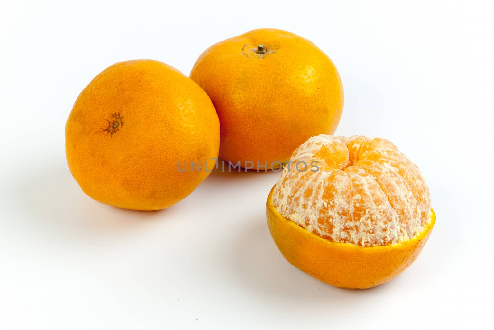 Ripe oranges isolated on white background. Orange in a cut.