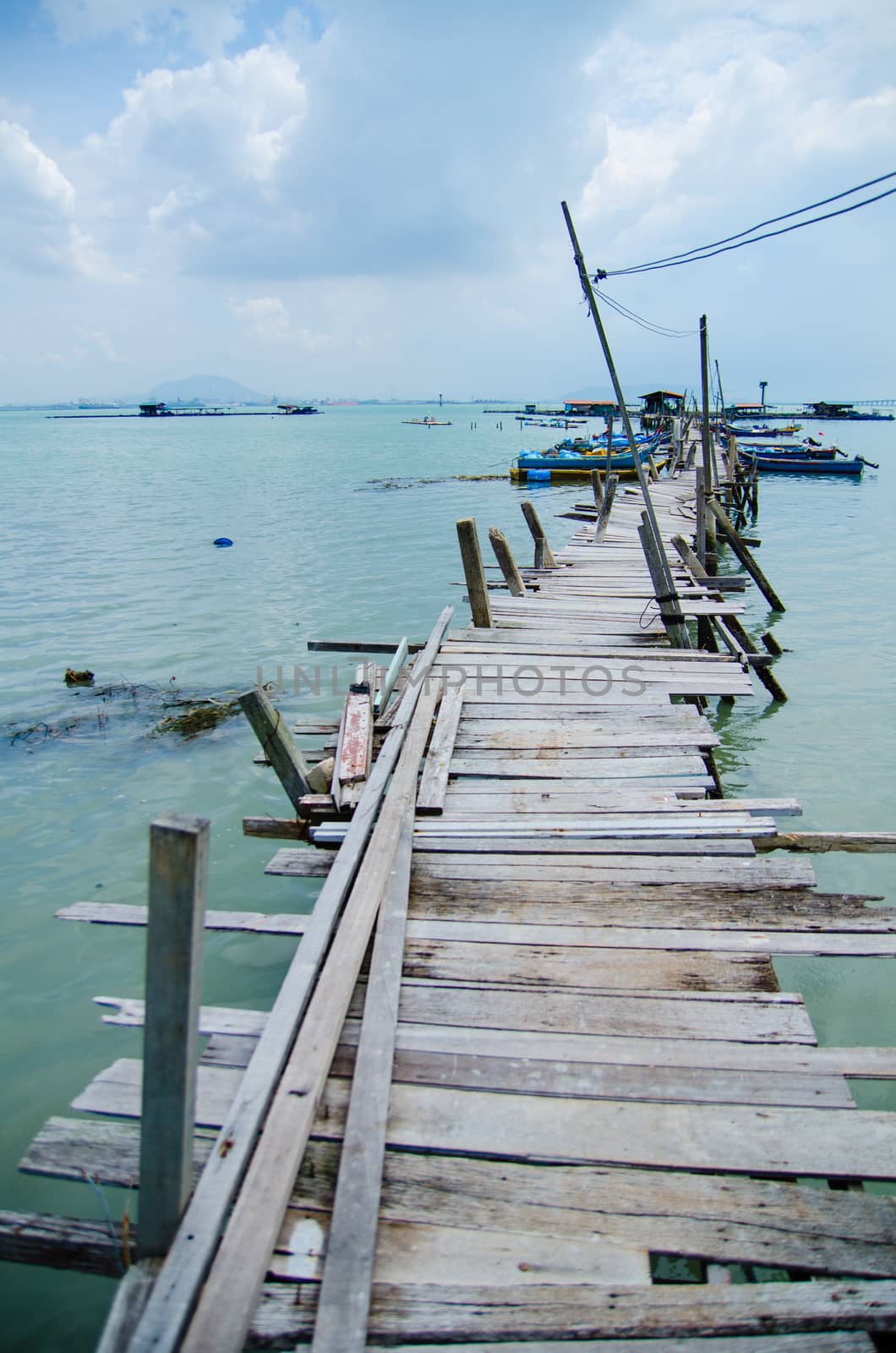 Wooden pier on the sea background by Vanzyst