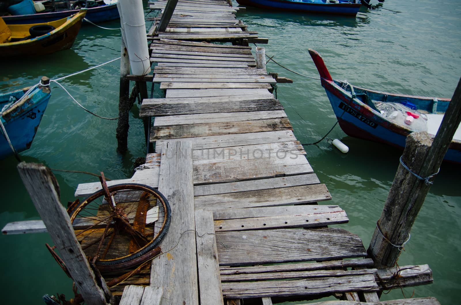 Wooden pier on the sea background, destroyed bridge near tropics. Color panorama