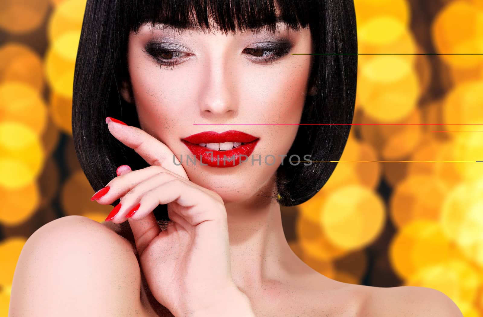 Pretty woman against an abstract background with blurred lights