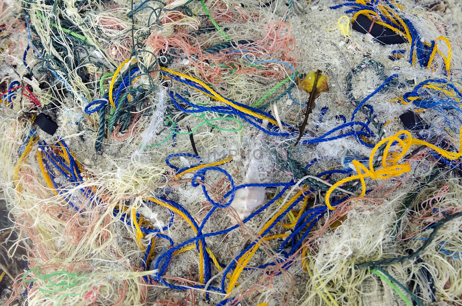 Background of color fishing net and cord on the heap by Vanzyst