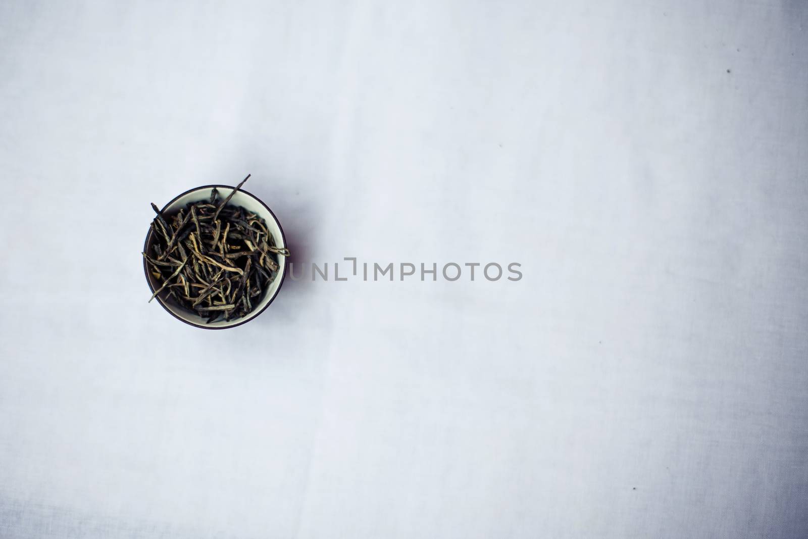 Bunch of tea puer in mug isolated on white background