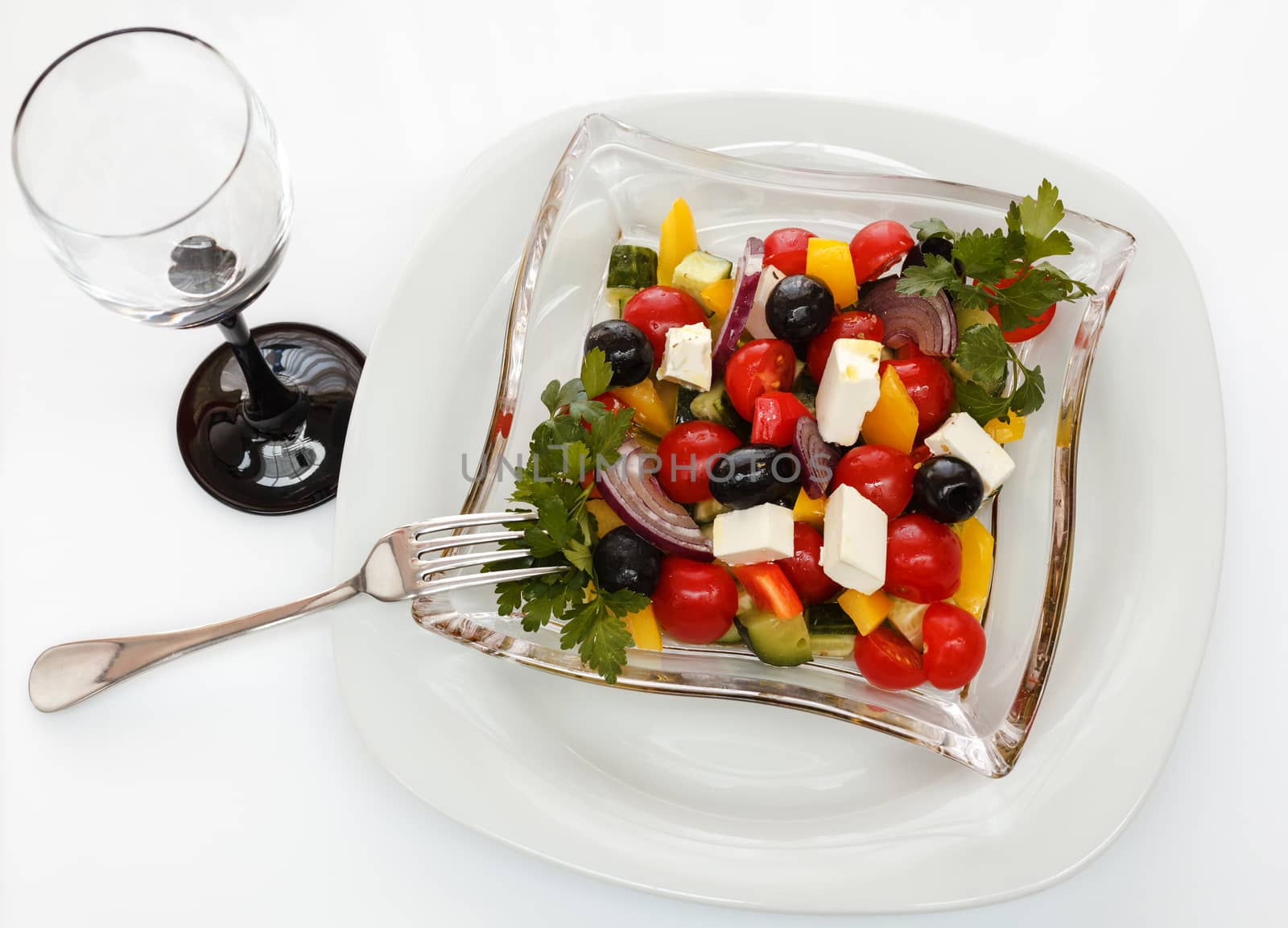 salad of fresh vegetables, shot on a sheet of white plastic, close-up