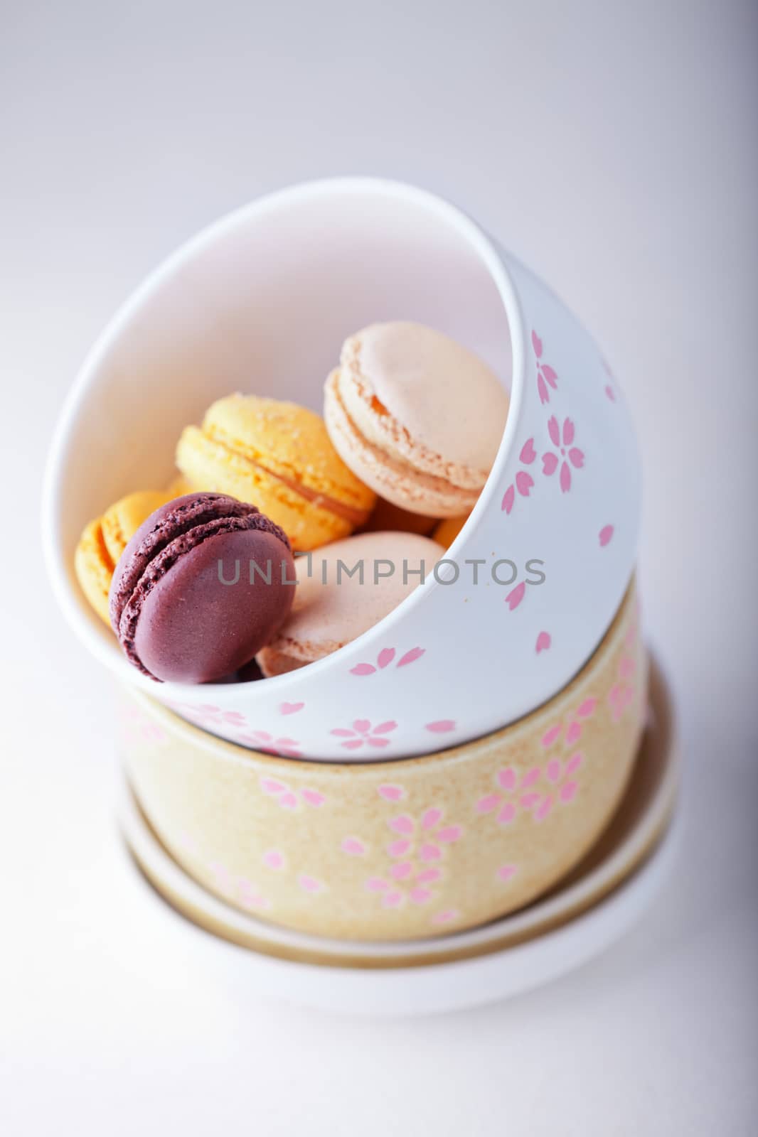 Plate of colorful macaroons on a white plate
