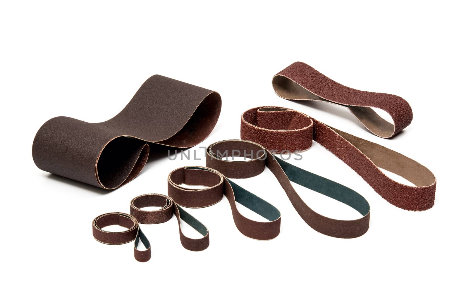 Industrial Sanding Belts Sand Papers in Rolls on White Background