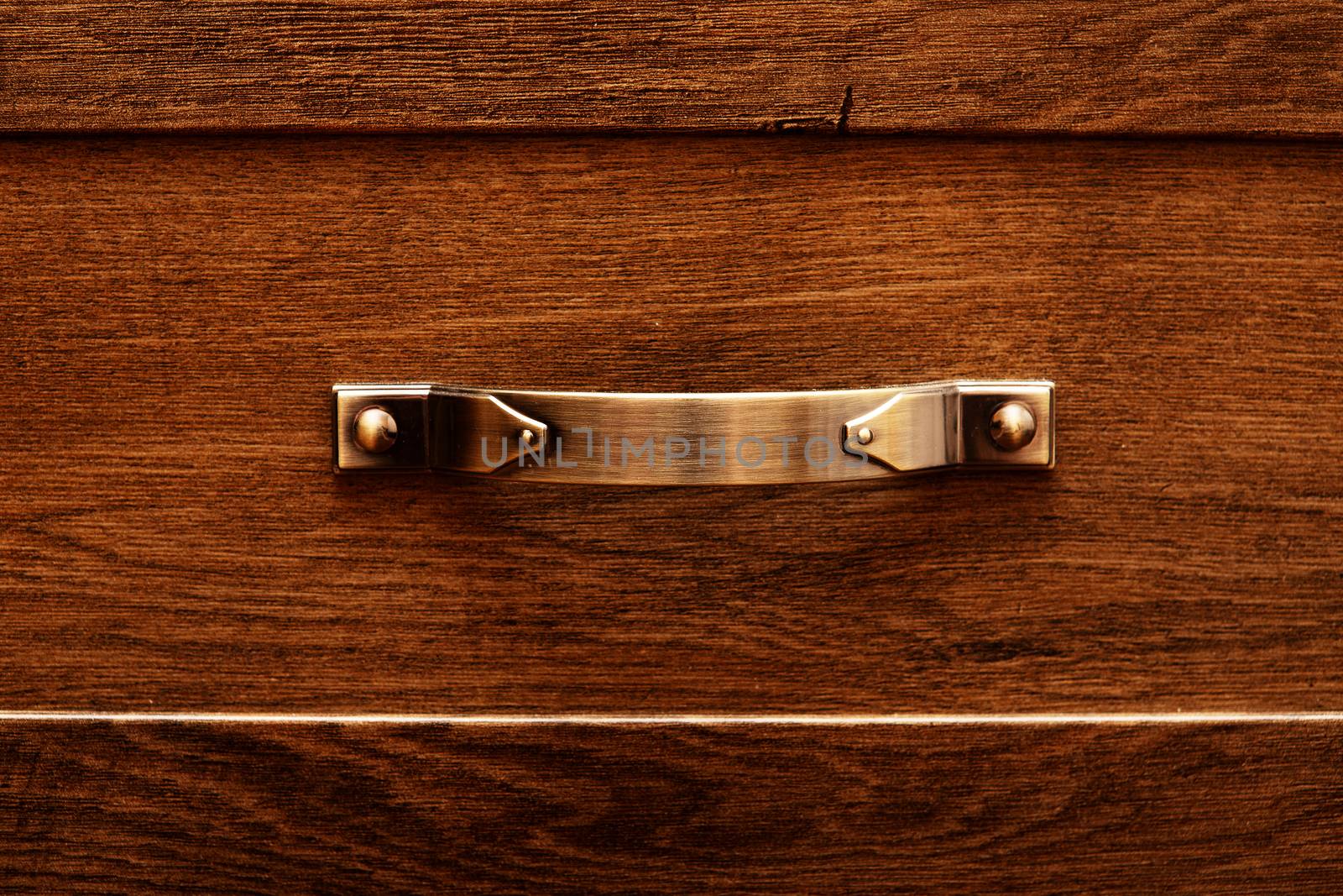 detail of decorated furniture drawers. old drawer - damper. Close-up detail of high quality Oak wood cabinets with bronze cabinet hardware drawer pulls