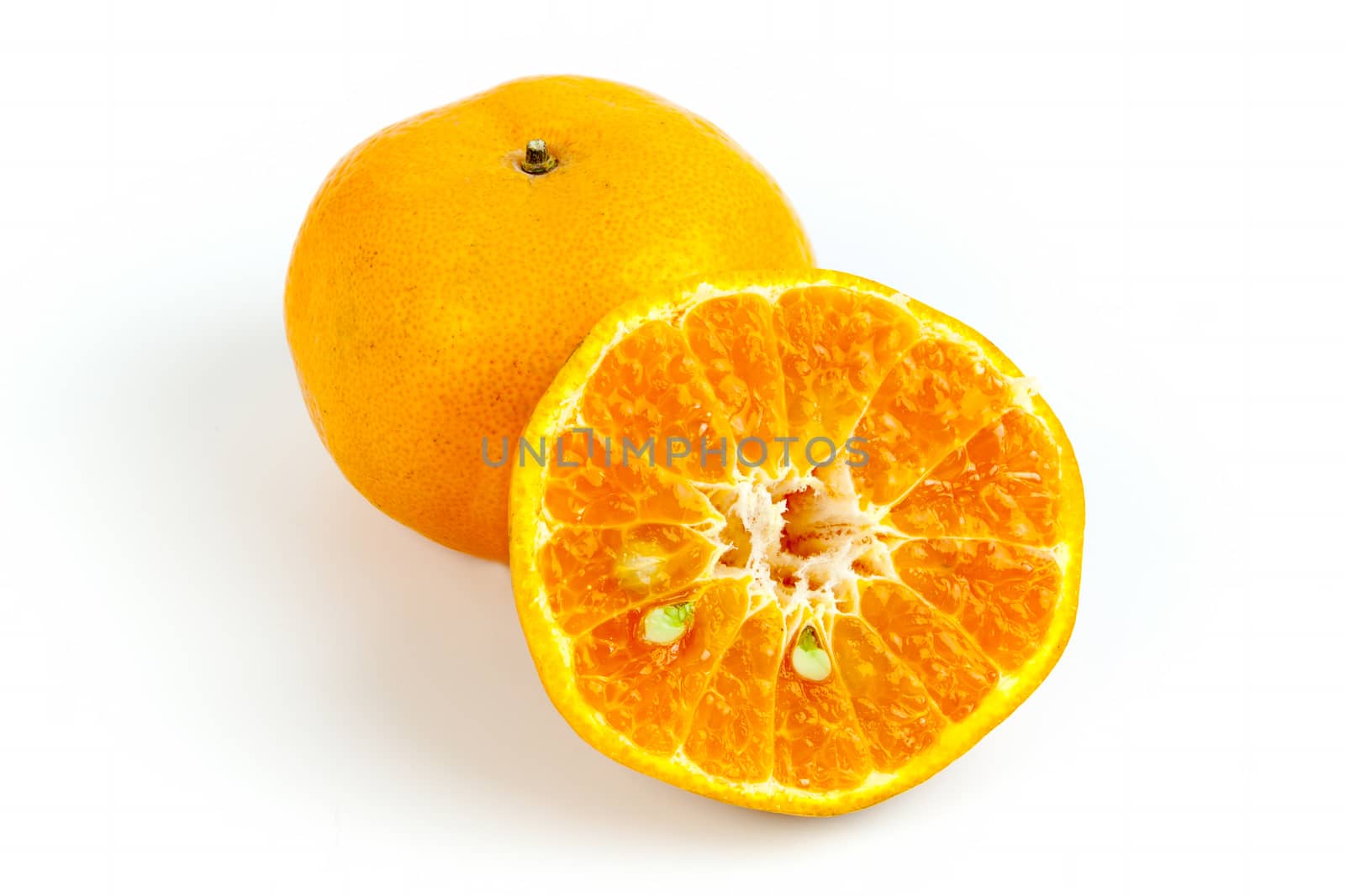 Ripe oranges isolated on white background. Orange in a cut.