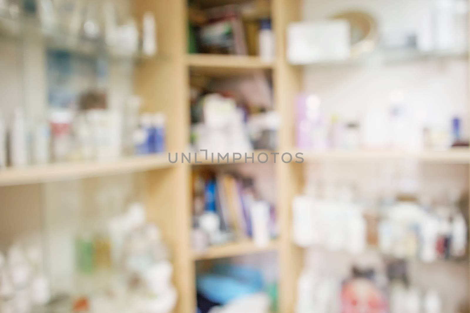 blur background medicine shelves in drug store. by natazhekova